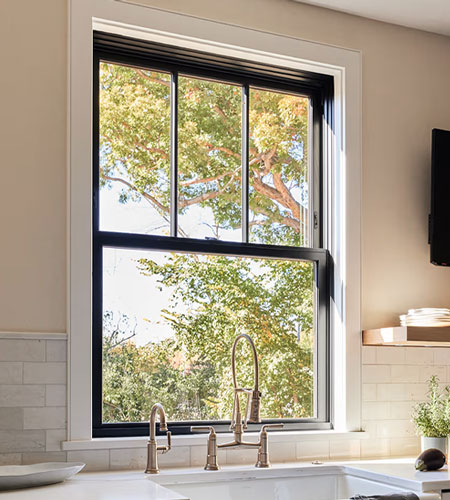 Black double hung Marvin Window above a kitchen sink